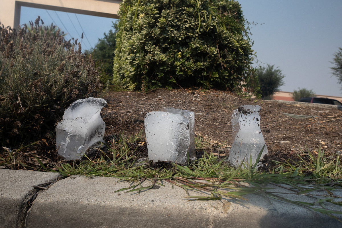 three small blocks of ice outside of home depot 