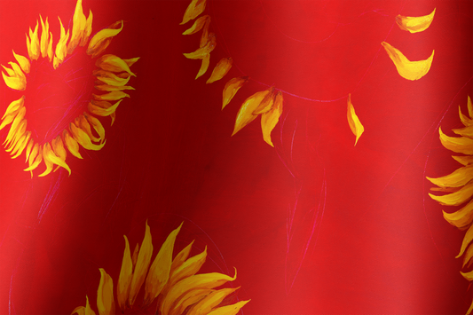 Close up red silk scarf with sunflowers